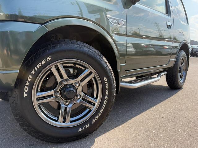 ジムニー ランドベンチャー パナソニックSDナビ フルセグTV バックモニター 革巻きステアリング ハーフレザーシート 運転席シートヒーター ETC車載器 サイドステップ LEDウィンカーミラー 純正16インチAW スペアタイヤ(42枚目)