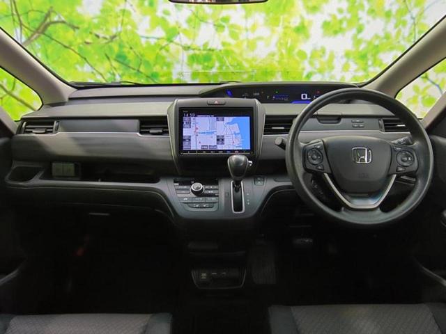 フリード Ｇブラックスタイル　新品タイヤ／保証書／純正　９インチ　メモリーナビ／ホンダセンシング／両側電動スライドドア／シートヒーター　前席／車線逸脱防止支援システム／パーキングアシスト　バックガイド　衝突被害軽減システム　禁煙車（4枚目）