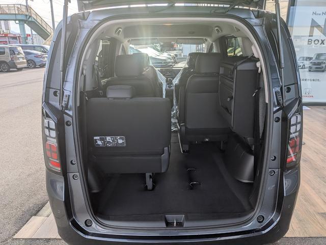 フリード ｅ：ＨＥＶエアー　ＥＸ　６人　新車未登録車　両側パワースライドドア　アダプティブクルーズコントロール　ホンダセンシング　マルチビューカメラシステム　ブラインドスポットインフォメーション　２列目キャプテンシート　シートヒーター（49枚目）