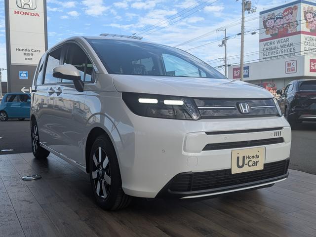 フリード ｅ：ＨＥＶエアー　６人乗り　新車未登録車　ホンダセンシング　ブラインドスポットインフォメーション　後退出庫サポート　２列目キャプテンシート　コンビシート　シートヒーター　電子パーキング　両側パワースライドドア（5枚目）