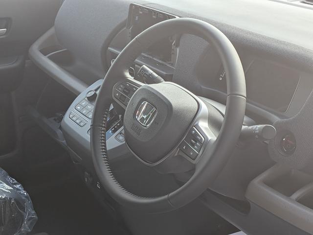 フリード ｅ：ＨＥＶエアー　６人乗り　新車未登録車　ホンダセンシング　ブラインドスポットインフォメーション　後退出庫サポート　２列目キャプテンシート　コンビシート　シートヒーター　電子パーキング　両側パワースライドドア（26枚目）