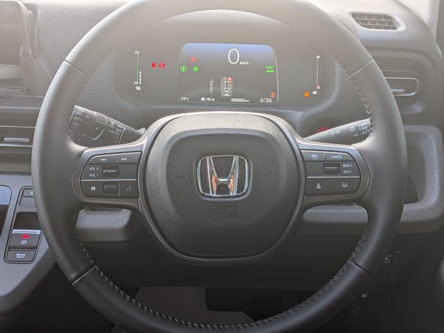 フリード ｅ：ＨＥＶエアー　６人乗り　新車未登録車　ホンダセンシング　ブラインドスポットインフォメーション　後退出庫サポート　２列目キャプテンシート　コンビシート　シートヒーター　電子パーキング　両側パワースライドドア（33枚目）