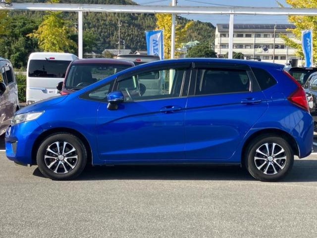 フィット 13G・Fパッケージ 純正 SDナビ/EBD付ABS/横滑り防止装置/アイドリングストップ/エアバッグ 運転席/エアバッグ 助手席/アルミホイール 社外 14インチ/パワーウインドウ/キーレスエントリー 盗難防止装置(2枚目)