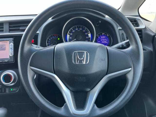 フィット 13G・Fパッケージ 純正 SDナビ/EBD付ABS/横滑り防止装置/アイドリングストップ/エアバッグ 運転席/エアバッグ 助手席/アルミホイール 社外 14インチ/パワーウインドウ/キーレスエントリー 盗難防止装置(13枚目)