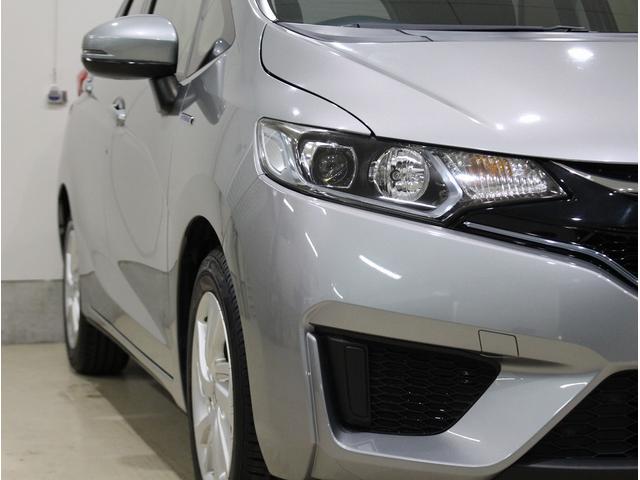 フィットハイブリッド Ｌパッケージ　純正ＨＤＤナビ・バックカメラ・ＥＴＣ・クルーズコントロール・ハーフレザーシート・本革巻きステアリング・ステアリングリモコン・ＬＥＤライト・ＡＵＴＯライト・衝突軽減システム・電動格納ミラー（4枚目）