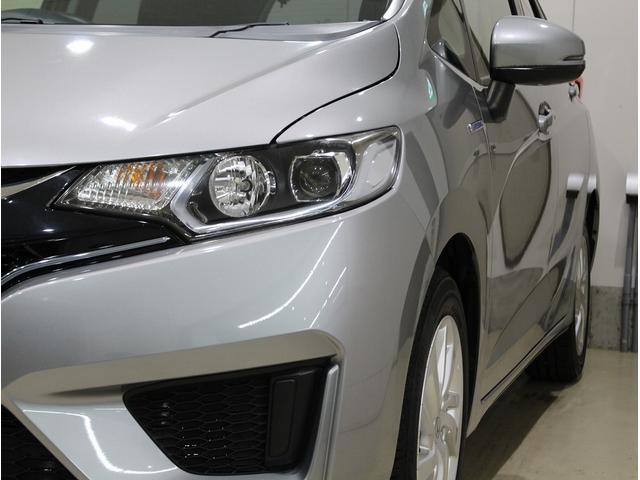 フィットハイブリッド Ｌパッケージ　純正ＨＤＤナビ・バックカメラ・ＥＴＣ・クルーズコントロール・ハーフレザーシート・本革巻きステアリング・ステアリングリモコン・ＬＥＤライト・ＡＵＴＯライト・衝突軽減システム・電動格納ミラー（5枚目）