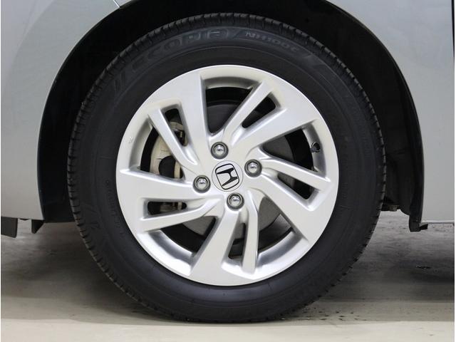 フィットハイブリッド Ｌパッケージ　純正ＨＤＤナビ・バックカメラ・ＥＴＣ・クルーズコントロール・ハーフレザーシート・本革巻きステアリング・ステアリングリモコン・ＬＥＤライト・ＡＵＴＯライト・衝突軽減システム・電動格納ミラー（19枚目）