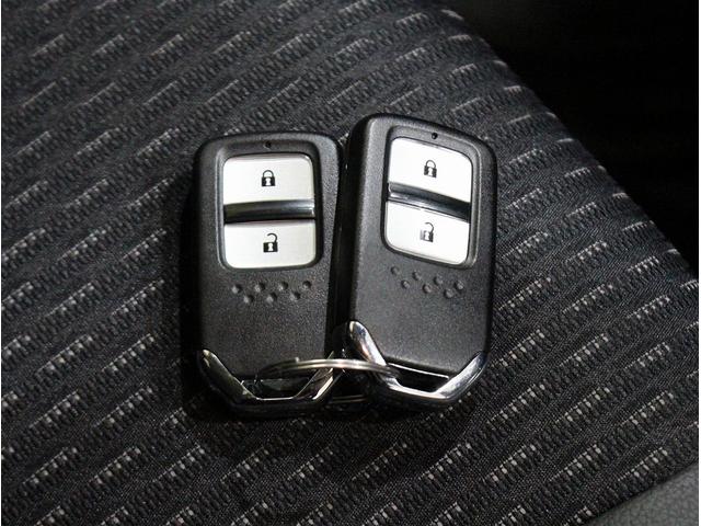 フィットハイブリッド Ｌパッケージ　純正ＨＤＤナビ・バックカメラ・ＥＴＣ・クルーズコントロール・ハーフレザーシート・本革巻きステアリング・ステアリングリモコン・ＬＥＤライト・ＡＵＴＯライト・衝突軽減システム・電動格納ミラー（32枚目）