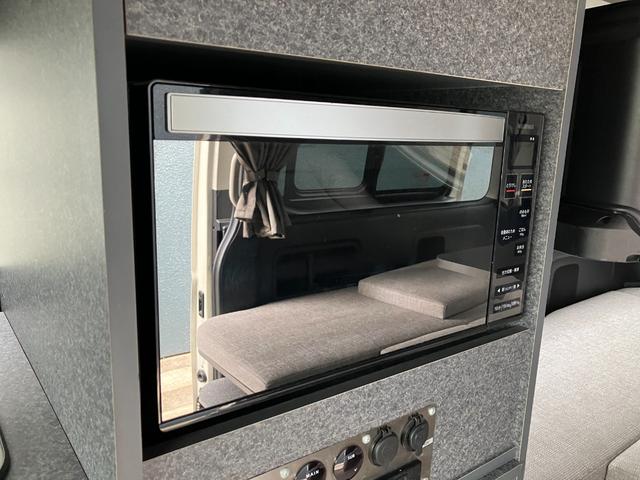 ハイエースワゴン キャンピングカー フルセグテレビ キーレスエントリー メモリーナビ バックカメラ ABS キャンピングカー(バンコン) 電動格納ミラー 走行充電 インバーター 外部電源取り込み 座席兼用ベッド シンク 電子レンジ(30枚目)