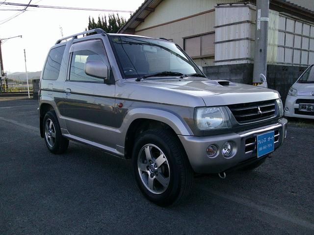パジェロミニ アニバーサリーリミテッド タイミングベルト交換済み ナビ テレビ CD DVD SD ミュージックホルダー ブルートゥース ハンズフリー ETC アルミ 電格ミラー 取説保証書 フォグランプ キーレス(4枚目)