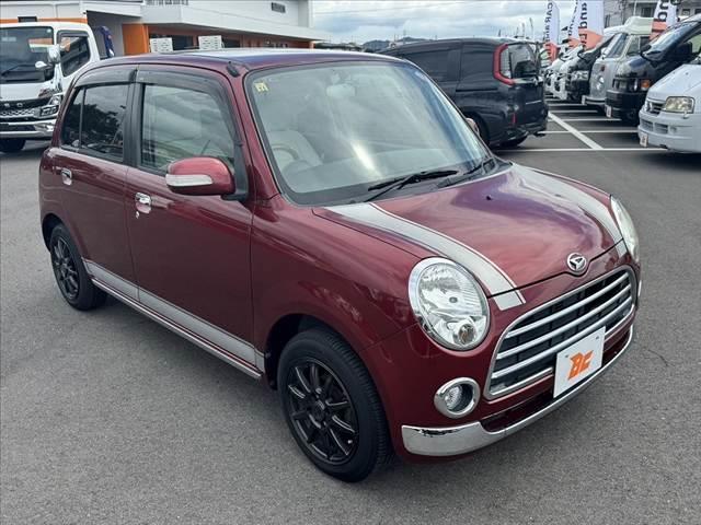 ミラジーノ プレミアムＬ　車検整備付　社外ＳＤナビ　地デジ　ＤＶＤ再生　ＥＴＣ　ＭＯＭＯ製ウッドコンビハンドル　電格ミラー　キーレス　レザー調シートカバー　ＬＥＤヘッド　フォグライト　Ｐガラス　社外１４ＡＷ　マットバイザー（8枚目）