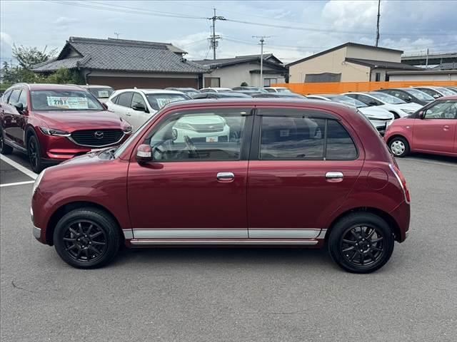 ミラジーノ プレミアムＬ　車検整備付　社外ＳＤナビ　地デジ　ＤＶＤ再生　ＥＴＣ　ＭＯＭＯ製ウッドコンビハンドル　電格ミラー　キーレス　レザー調シートカバー　ＬＥＤヘッド　フォグライト　Ｐガラス　社外１４ＡＷ　マットバイザー（11枚目）