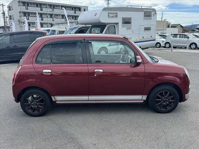 ミラジーノ プレミアムＬ　車検整備付　社外ＳＤナビ　地デジ　ＤＶＤ再生　ＥＴＣ　ＭＯＭＯ製ウッドコンビハンドル　電格ミラー　キーレス　レザー調シートカバー　ＬＥＤヘッド　フォグライト　Ｐガラス　社外１４ＡＷ　マットバイザー（12枚目）