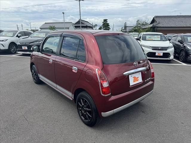 ミラジーノ プレミアムＬ　車検整備付　社外ＳＤナビ　地デジ　ＤＶＤ再生　ＥＴＣ　ＭＯＭＯ製ウッドコンビハンドル　電格ミラー　キーレス　レザー調シートカバー　ＬＥＤヘッド　フォグライト　Ｐガラス　社外１４ＡＷ　マットバイザー（13枚目）