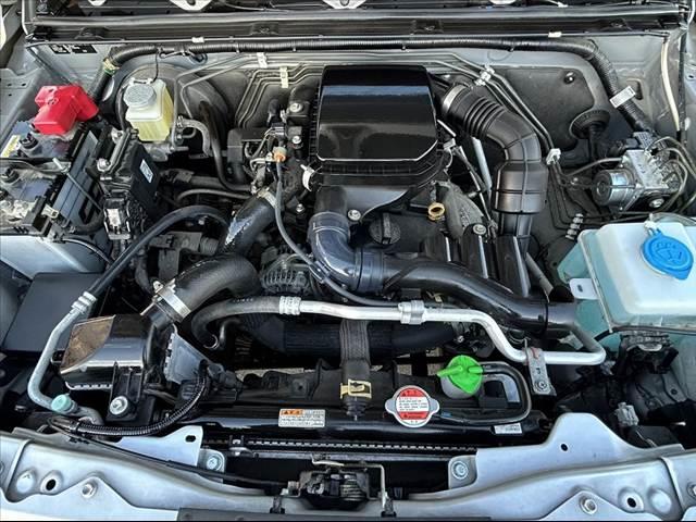 ジムニー XG 禁煙車 5MT 4WD 社外SDナビ フルセグ BT DVD キーレス スペアキー 横滑り防止 チルトステア ヨコハマ製マッドタイヤ サイドカーテンエアB マット プライバシーガラス レベライザー(40枚目)