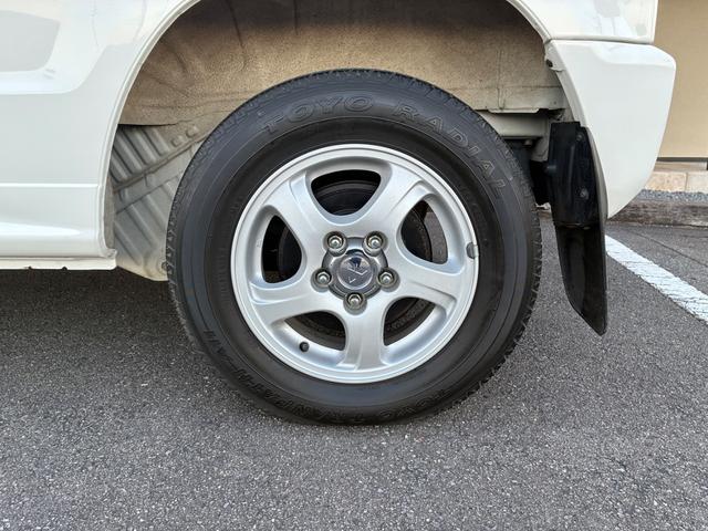 パジェロミニ Ｘ　５ＭＴ　４ＷＤ　禁煙車　ワンオーナー　純正オーディオ　純正アルミホイール　ＥＴＣ　電動格納式ドアミラー　キーレス　衝突安全ボディ　運転席助手席エアバック　エアコン　パワステ　ドアバイザー　フロアマット（23枚目）