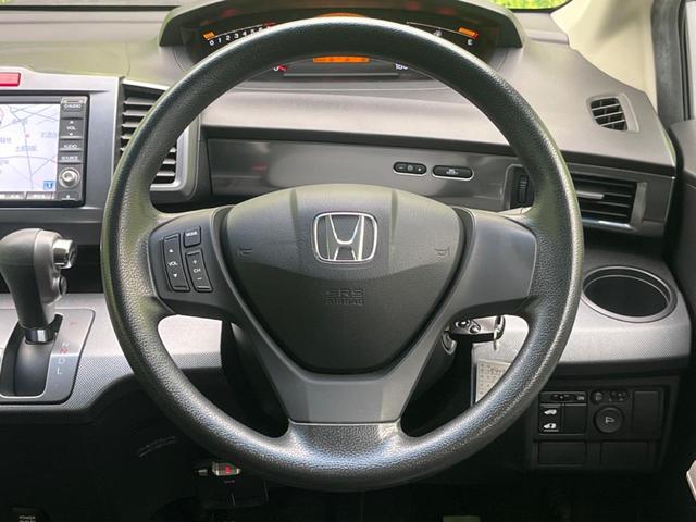 フリード G エアロ ジャストセレクション 電動スライドドア 純正ナビ バックカメラ 禁煙車 HIDヘッド ETC オートライト オートエアコン 16インチアルミ CD DVD再生 地デジ ドアバイザー プライバシーガラス(12枚目)