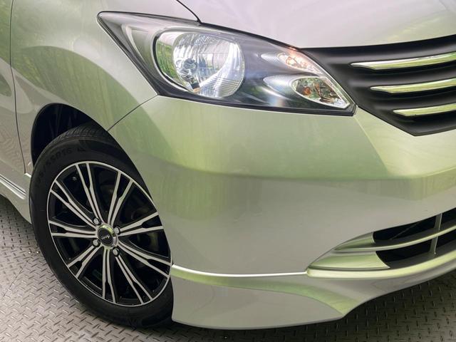 フリード G エアロ ジャストセレクション 電動スライドドア 純正ナビ バックカメラ 禁煙車 HIDヘッド ETC オートライト オートエアコン 16インチアルミ CD DVD再生 地デジ ドアバイザー プライバシーガラス(13枚目)