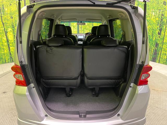 フリード G エアロ ジャストセレクション 電動スライドドア 純正ナビ バックカメラ 禁煙車 HIDヘッド ETC オートライト オートエアコン 16インチアルミ CD DVD再生 地デジ ドアバイザー プライバシーガラス(34枚目)