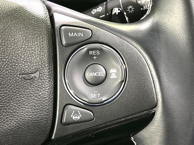 ヴェゼル ハイブリッドZ・ホンダセンシング 禁煙車 純正8型ナビ バックカメラ レーダークルーズ LEDヘッドライト シートヒーター コーナーセンサー ハーフレザーシート 革巻きステアリング 純正17インチアルミ パドルシフト オートライト(5枚目)