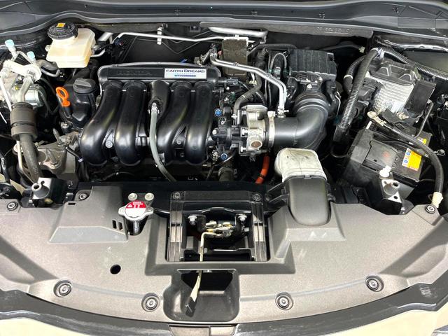 ヴェゼル ハイブリッドZ・ホンダセンシング 禁煙車 純正8型ナビ バックカメラ レーダークルーズ LEDヘッドライト シートヒーター コーナーセンサー ハーフレザーシート 革巻きステアリング 純正17インチアルミ パドルシフト オートライト(18枚目)