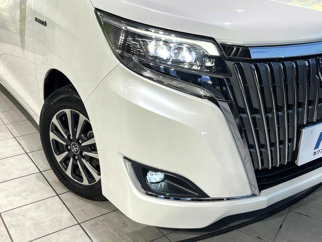 エスクァイア ハイブリッドGi プレミアムパッケージ 禁煙車 純正9型ナビ フリップダウンモニター 両側電動スライドドア セーフティセンス バックカメラ シートヒーター LEDヘッドライト クルーズコントロール ステアリングヒーター オートハイビーム(12枚目)