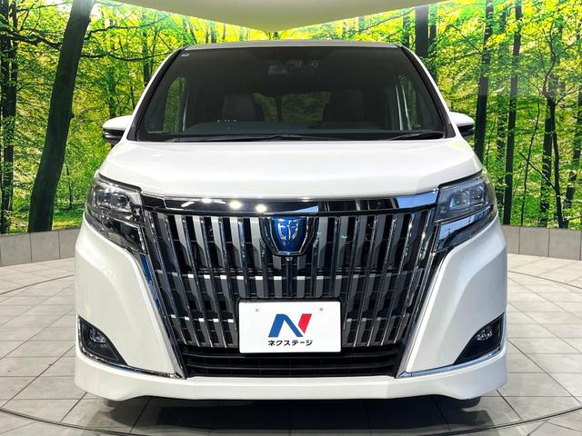 エスクァイア ハイブリッドGi プレミアムパッケージ 禁煙車 純正9型ナビ フリップダウンモニター 両側電動スライドドア セーフティセンス バックカメラ シートヒーター LEDヘッドライト クルーズコントロール ステアリングヒーター オートハイビーム(14枚目)
