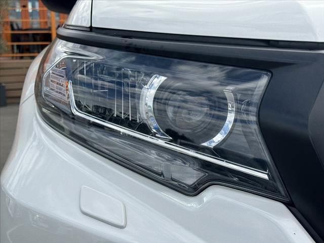 ランドクルーザープラド ＴＸ　後期　禁煙　ムーンルーフ　社外９型ナビ　ＢＴ　ＥＴＣ　Ｂカメ　Ｃセンサー　ルーフレール　ＡＣＣ　ＬＥＤヘッド　Ａライト　Ａハイビーム　車高調　デフロック　ウッドコンビハン　寒冷地　純正１７インチＡＷ（33枚目）