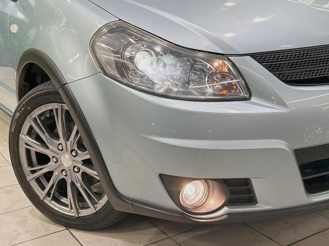 ＳＸ４ １．５ＸＧ　禁煙車　ポータブルナビ　ＥＴＣ２．０　オートエアコン　オートライト　電動格納ミラー　ＨＩＤヘッドライト　フロントフォグランプ　プライバシーガラス　純正革巻きステアリング（12枚目）
