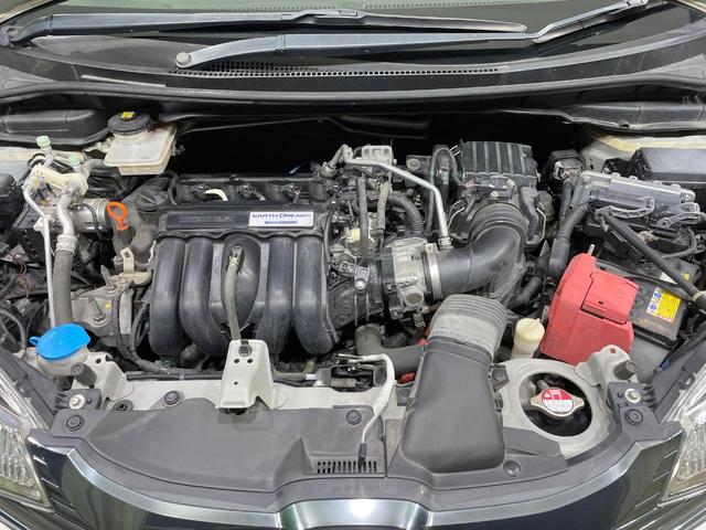 フィットハイブリッド Lパッケージ 禁煙車 純正SDナビ シティブレーキアクティブシステム クルーズコントロール ハーフレザー LEDヘッド バックカメラ ETC オートエアコン スマートキー オートライト(18枚目)