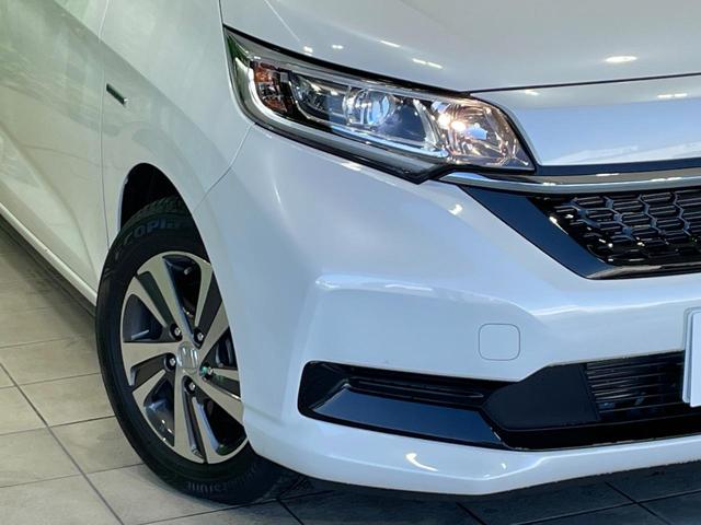 フリードハイブリッド ハイブリッド・Gホンダセンシング 禁煙車 両側電動ドア 純正9インチSDナビ バックカメラ 衝突被害軽減システム ハーフレザーシート 前席シートエアコン ドラレコ スマートキー LEDヘッド ETC クルコン 純正15インチアルミ(12枚目)