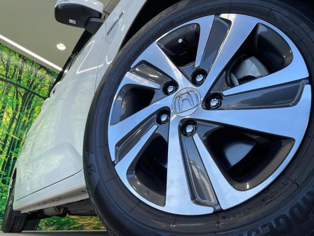 フリードハイブリッド ハイブリッド・Gホンダセンシング 禁煙車 両側電動ドア 純正9インチSDナビ バックカメラ 衝突被害軽減システム ハーフレザーシート 前席シートエアコン ドラレコ スマートキー LEDヘッド ETC クルコン 純正15インチアルミ(13枚目)