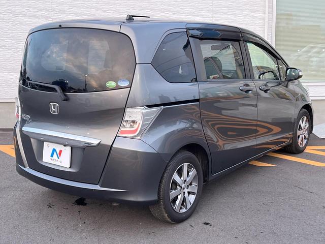 フリード GH メモリーナビ 電動スライドドア バックカメラ 禁煙車 HIDヘッド ETC オートライト オートエアコン 純正15インチアルミ CD DVD再生 地デジ(17枚目)