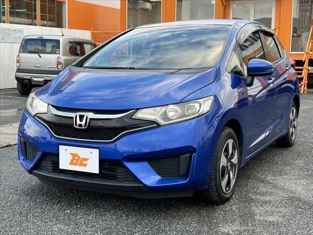 フィットハイブリッド Ｌパッケージ　禁煙　中期　純正ナビ／Ｂｌｕｅｔｏｏｔｈ　クルコン　ＣＴＢＡ　ＬＥＤヘッド　Ｐガラス　革巻きステア　電動格納ミラー　プラズマクラスター　プライムスムースコンビシート　スマートキー　Ｐスタート（8枚目）