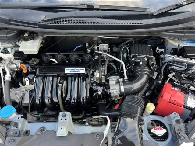 フィットハイブリッド Ｌパッケージ　禁煙　中期　純正ナビ／Ｂｌｕｅｔｏｏｔｈ　クルコン　ＣＴＢＡ　ＬＥＤヘッド　Ｐガラス　革巻きステア　電動格納ミラー　プラズマクラスター　プライムスムースコンビシート　スマートキー　Ｐスタート（56枚目）