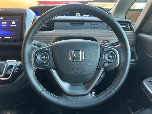 フリードハイブリッド ハイブリッド・クロスターホンダセンシング　禁煙車　車検整備付　後期　９型ナビ　ホンダセンシング　フルセグ　バックカメラ　両電スラ　ＬＥＤヘッド　オートライト　スマートキー　純１５インチＡＷ　合皮コンビシート　ルーフレール　ＥＴＣ　ドラレコ（27枚目）