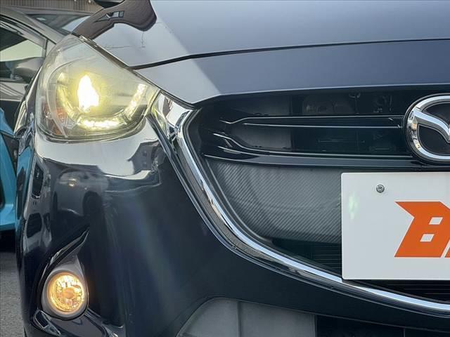 デミオ 13S Lパッケージ 車検整備付 禁煙車 純正ナビ HUD BT LED Aライト フォグ ステリモ ETC スマートキー×2 Pスタート ABS AAC 電格ミラー Aストップ 横滑り防止 衝突被害軽減ブレーキ Pガラス(34枚目)