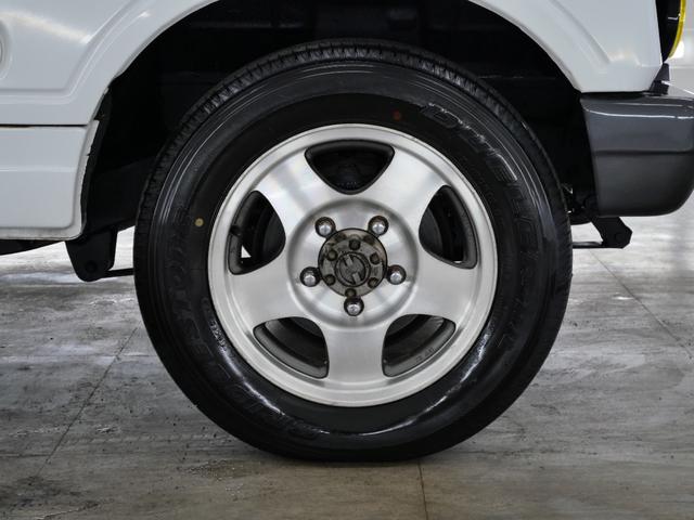 ジムニー CC 後付けパワーステアリング(純正流用) 純正オプションフォグライト 防錆施工済み(ノックスドール) BesTop幌 モモステアリング シートカバー 1型グリル JA11V用アルミホイール Tベルト交換済(35枚目)