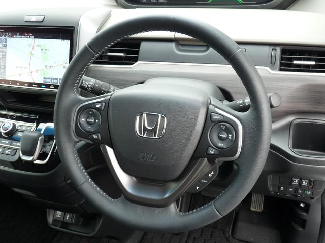 フリードハイブリッド ハイブリッド・Gホンダセンシング ・ワンオーナー ・禁煙 ・6人乗りシート ・純正9インチナビ ・リアカメラ ・ETC ・ホンダセンシング ・両側電動スライドドア ・フロントグリル ・LEDフォグライト ・ドアバイザー ・1年保証(12枚目)