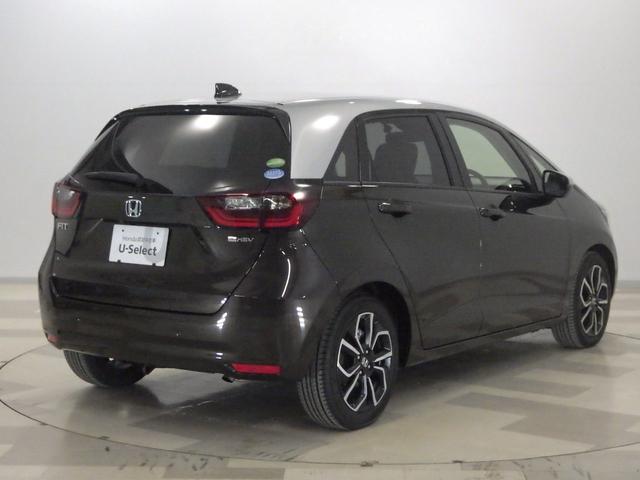 フィット e:HEVホーム 禁煙・2トーン・9インチナビ・前後ドラレコ・ETC・スマートキー・ホンダセンシング・パーキングセンサー・LED・フォグ・アルミ・1オーナー 前後誤発進抑制機能 クリソナ 助手席エアバッグ ACC(5枚目)