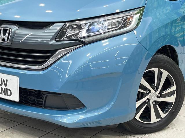 フリード Ｇ・ホンダセンシング　禁煙車　後席モニター　両側電動ドア　純正９型ナビ　バックカメラ　レーダークルーズ　ハーフレザーシート　純正１５インチアルミ　コーナーセンサー　スマートキー　ＬＥＤヘッド　ＥＴＣ　オートライト（15枚目）