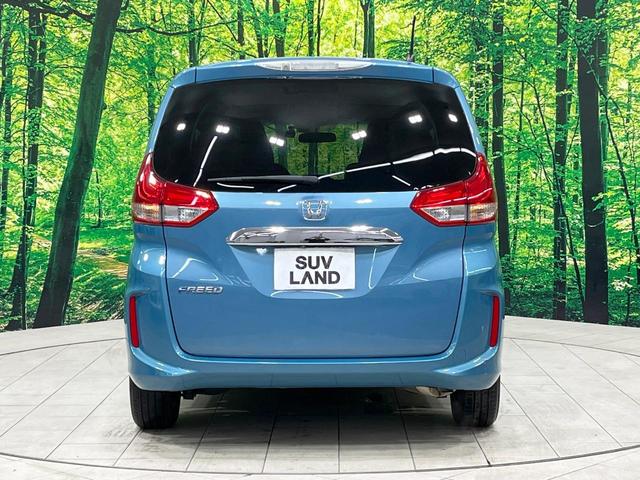 フリード Ｇ・ホンダセンシング　禁煙車　後席モニター　両側電動ドア　純正９型ナビ　バックカメラ　レーダークルーズ　ハーフレザーシート　純正１５インチアルミ　コーナーセンサー　スマートキー　ＬＥＤヘッド　ＥＴＣ　オートライト（18枚目）