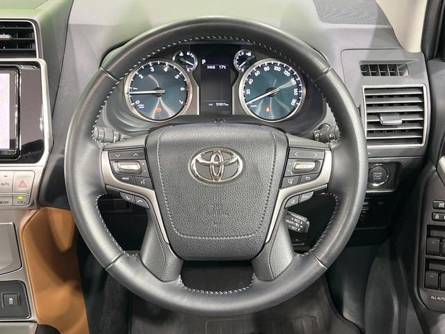 ランドクルーザープラド TX Lパッケージ 70thアニバーサリーリミテッド 禁煙車 サンルーフ 純正9型ナビ バックカメラ フルセグ レーダークルーズ シートベンチレーション 茶革 ETC パワーシート ステアリングスイッチ 純正AW ルーフレール LEDライト(12枚目)