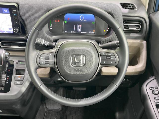 フリード e:HEVエアー EX 禁煙車 両側電動ドア 純正9型ナビ バックカメラ レーダークルーズ コーナーセンサー 純正15インチアルミ スマートキー LEDヘッド ビルトインETC オートハイビーム 車線逸脱警報 オートライト(12枚目)