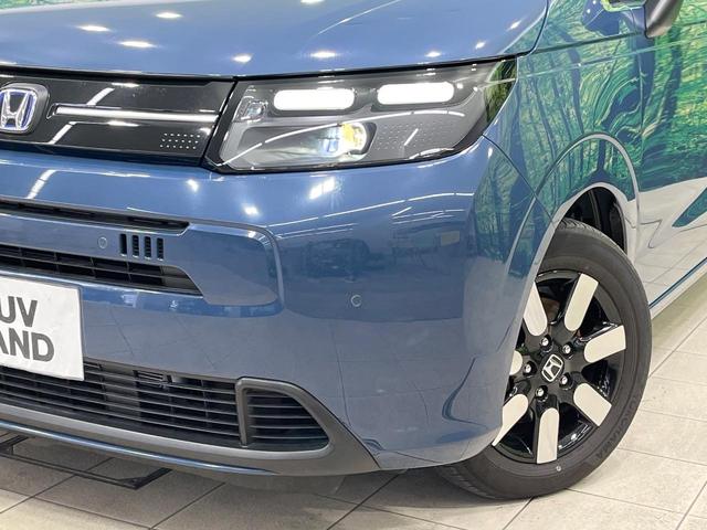 フリード e:HEVエアー EX 禁煙車 両側電動ドア 純正9型ナビ バックカメラ レーダークルーズ コーナーセンサー 純正15インチアルミ スマートキー LEDヘッド ビルトインETC オートハイビーム 車線逸脱警報 オートライト(13枚目)