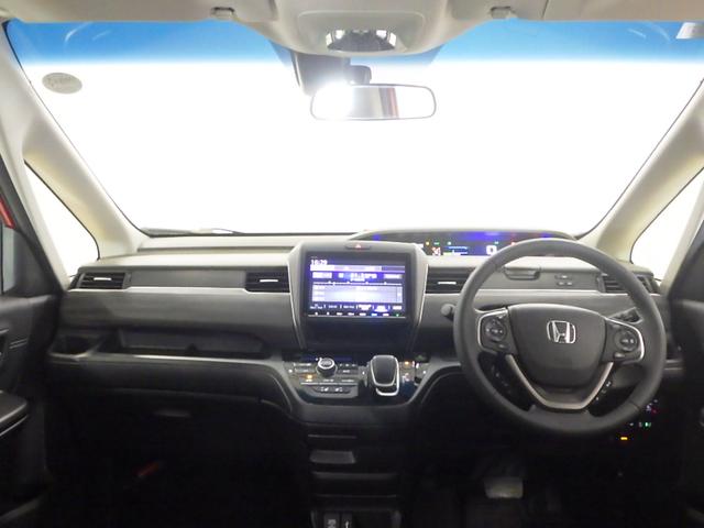 フリードハイブリッド ハイブリッド・Ｇホンダセンシング　ＬＥＤ・ＥＴＣ・スマートキー・リアカメラ・シートヒーター・１５ＡＷ・禁煙車・ベンチシート７人乗り　軽減ブレーキ　キーフリーシステム　電動格納式ドアミラー　１オ－ナ－　ＤＶＤ再生可能　ＥＣＯＮ　後カメラ（9枚目）