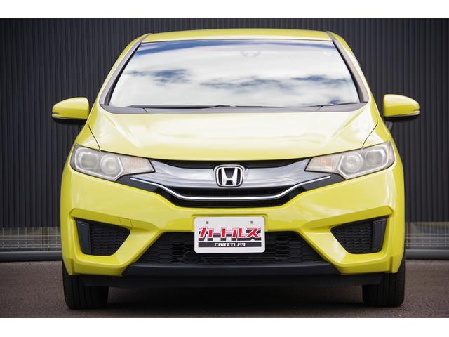 フィットハイブリッド Ｌパッケージ　電動格納式ミラー　ＡＵＴＯライト　ナビ＆ＴＶ　地デジフルセグＴＶ　ＵＳＢ　サイドエアバック　ＤＶＤ再生　バックカメラ　オートクルーズコントロール　イモビライザー　ＥＴＣ　ＥＳＣ　ＡＵＴＯエアコン（3枚目）