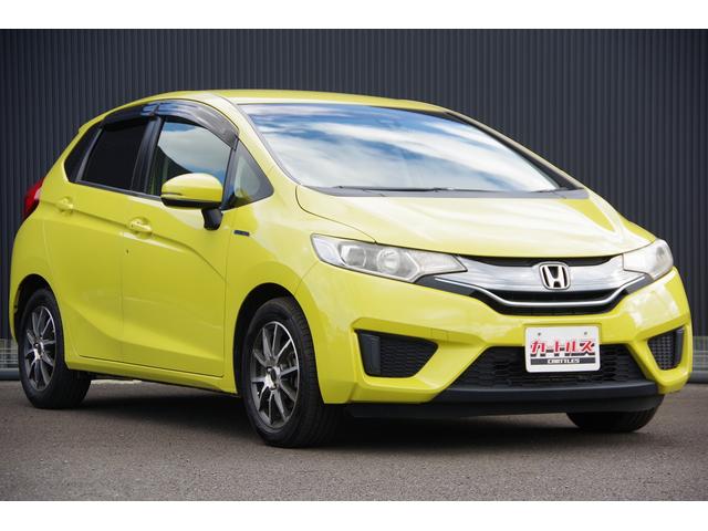 フィットハイブリッド Ｌパッケージ　電動格納式ミラー　ＡＵＴＯライト　ナビ＆ＴＶ　地デジフルセグＴＶ　ＵＳＢ　サイドエアバック　ＤＶＤ再生　バックカメラ　オートクルーズコントロール　イモビライザー　ＥＴＣ　ＥＳＣ　ＡＵＴＯエアコン（4枚目）