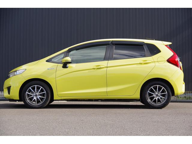 フィットハイブリッド Ｌパッケージ　電動格納式ミラー　ＡＵＴＯライト　ナビ＆ＴＶ　地デジフルセグＴＶ　ＵＳＢ　サイドエアバック　ＤＶＤ再生　バックカメラ　オートクルーズコントロール　イモビライザー　ＥＴＣ　ＥＳＣ　ＡＵＴＯエアコン（9枚目）