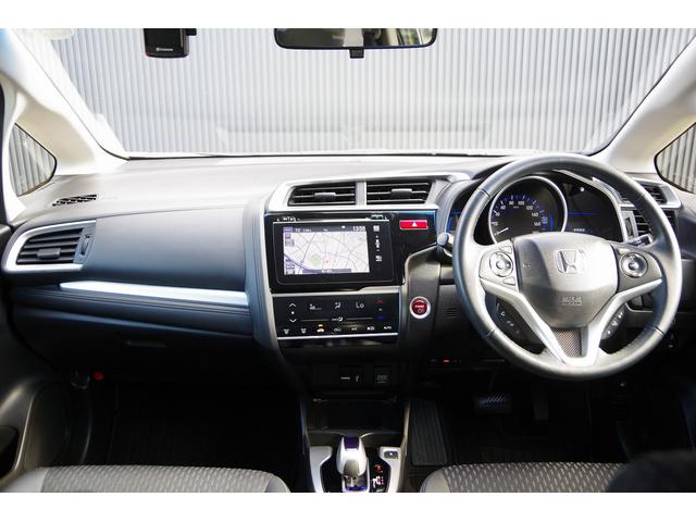 フィットハイブリッド Ｌパッケージ　電動格納式ミラー　ＡＵＴＯライト　ナビ＆ＴＶ　地デジフルセグＴＶ　ＵＳＢ　サイドエアバック　ＤＶＤ再生　バックカメラ　オートクルーズコントロール　イモビライザー　ＥＴＣ　ＥＳＣ　ＡＵＴＯエアコン（24枚目）